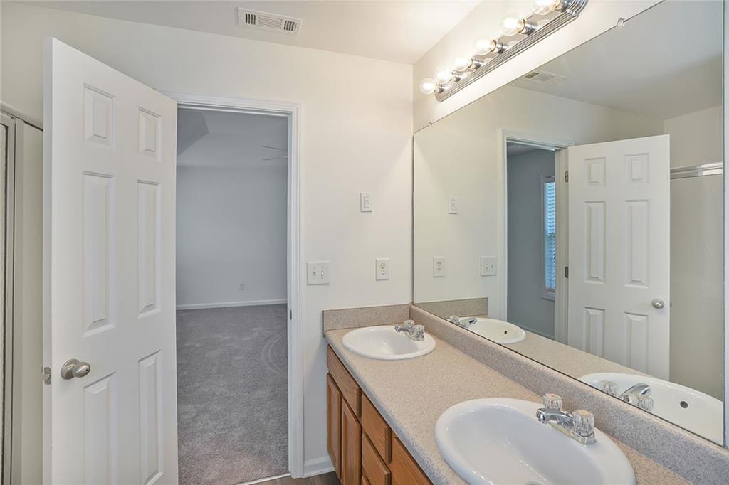 211 West Bridge Drive Dallas, GA 30157 - Photo 18 of 26 a bathroom with a sink and a mirror