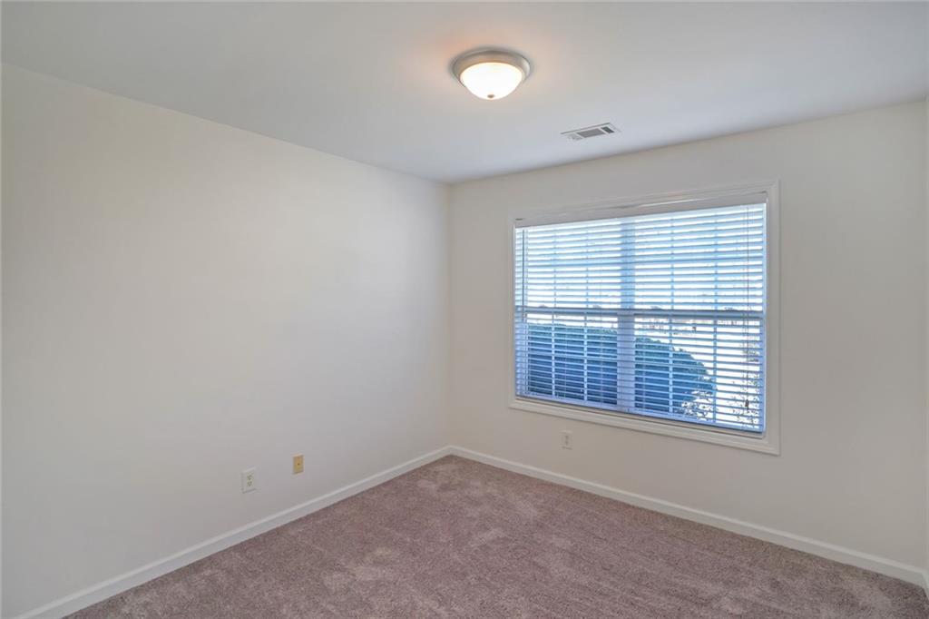 211 West Bridge Drive Dallas, GA 30157 - Photo 20 of 26 a view of an empty room with a window