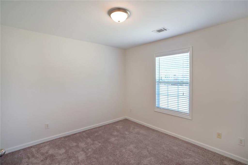 211 West Bridge Drive Dallas, GA 30157 - Photo 21 of 26 an empty room with a window