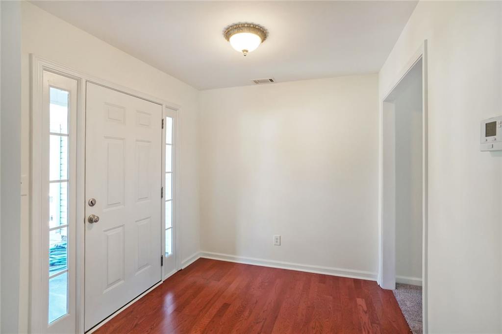 211 West Bridge Drive Dallas, GA 30157 - Photo 23 of 26 a view of an empty room with closet and a window