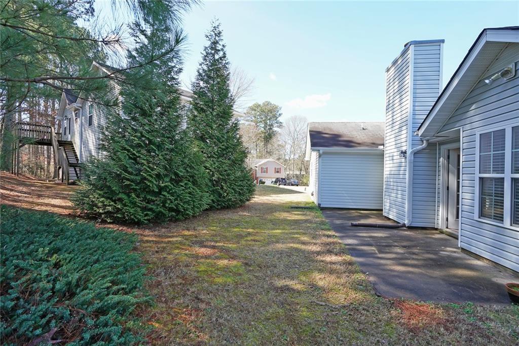 211 West Bridge Drive Dallas, GA 30157 - Photo 25 of 26 a backyard of a house with lots of green space