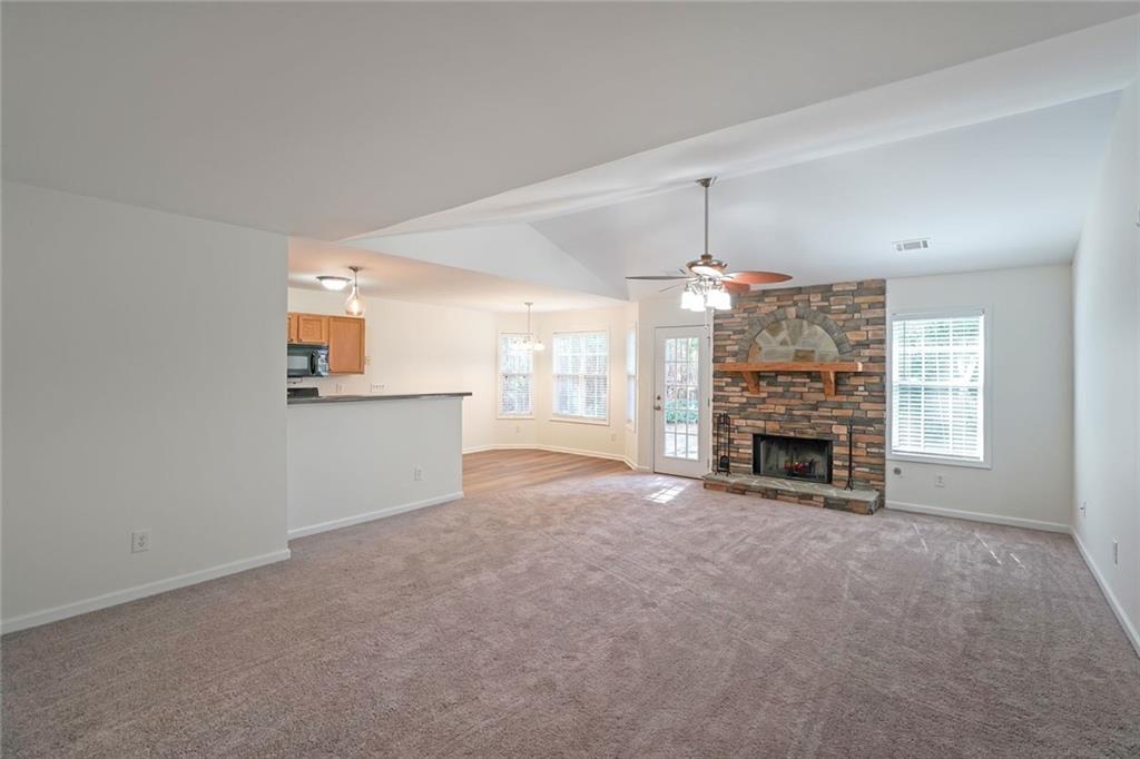 211 West Bridge Drive Dallas, GA 30157 - Photo 3 of 26 an empty room with windows and fireplace