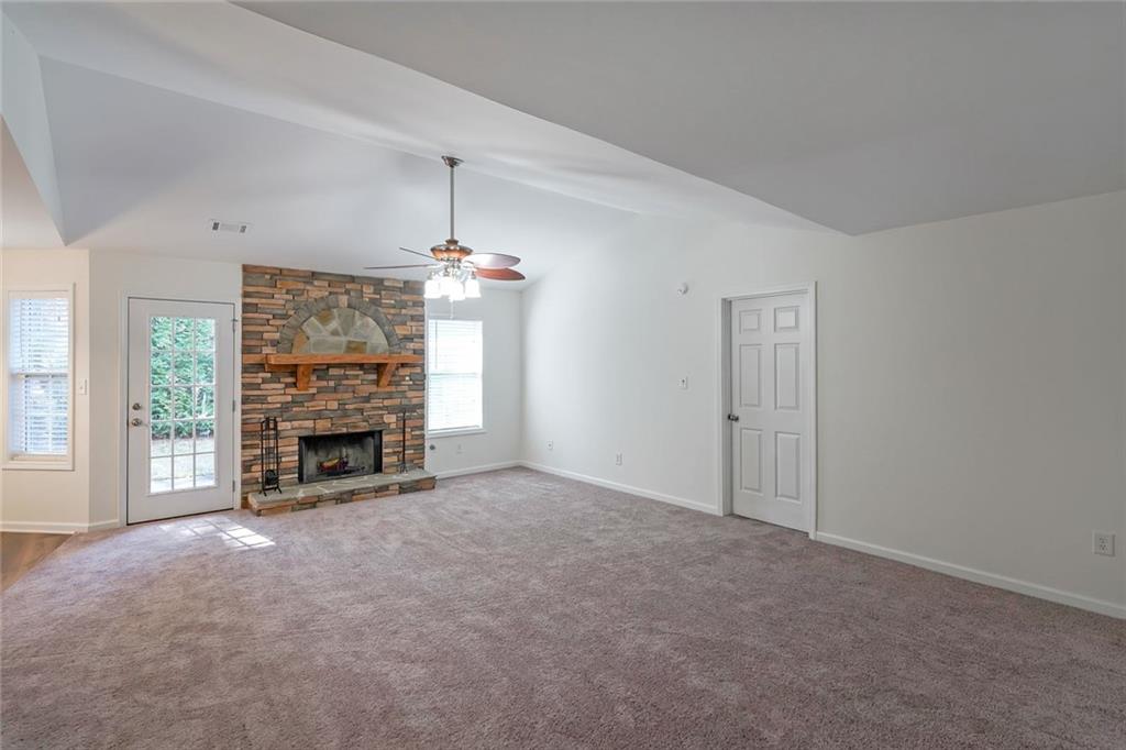 211 West Bridge Drive Dallas, GA 30157 - Photo 4 of 26 a view of an empty room with a fireplace