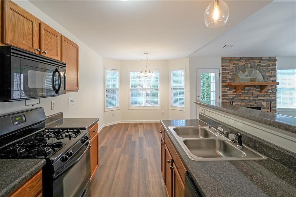 211 West Bridge Drive Dallas, GA 30157 - Photo 9 of 26 a kitchen that has a sink and a stove
