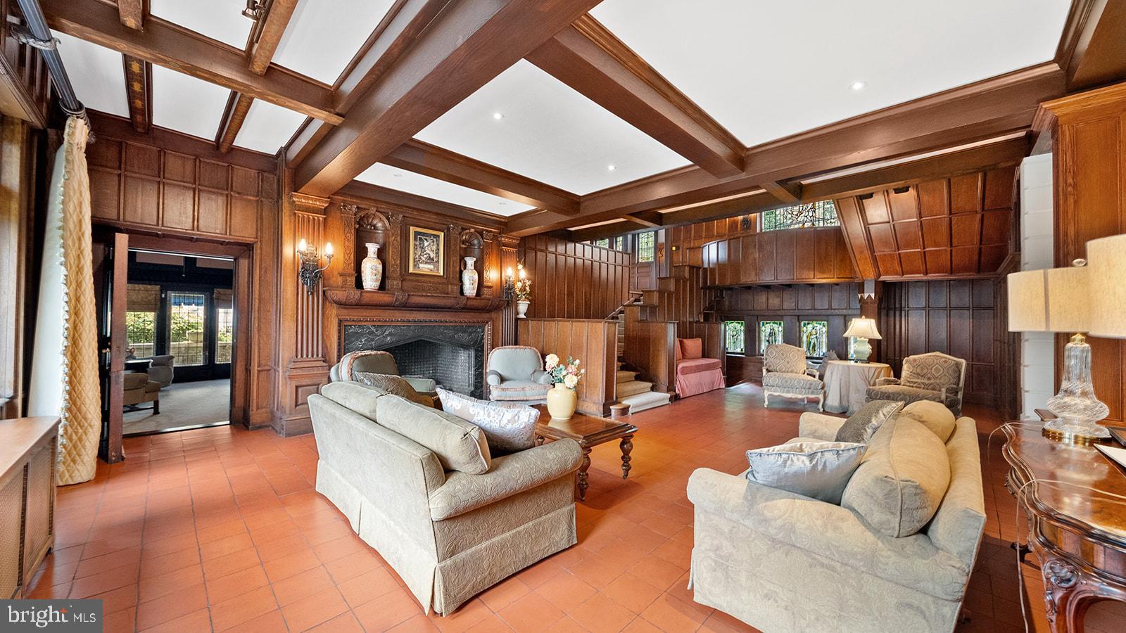 1717 Woodland Road Abington, PA 19001 - Photo 11 of 141 a living room with furniture a fireplace and a large window