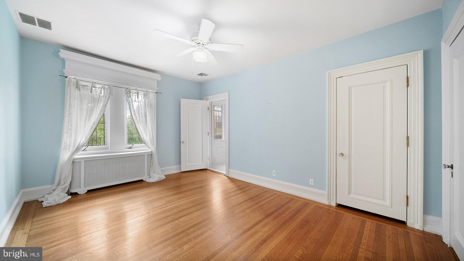 1717 Woodland Road Abington, PA 19001 - Photo 80 of 141 a view of an empty room with wooden floor and a window