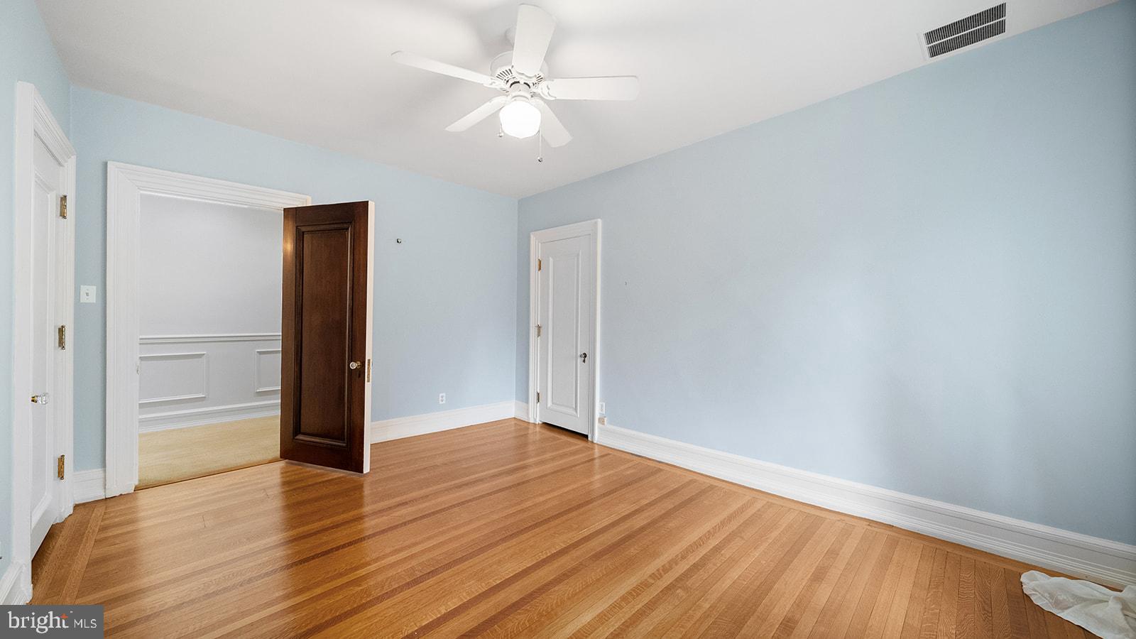 1717 Woodland Road Abington, PA 19001 - Photo 81 of 141 an empty room with wooden floor and ceiling fan
