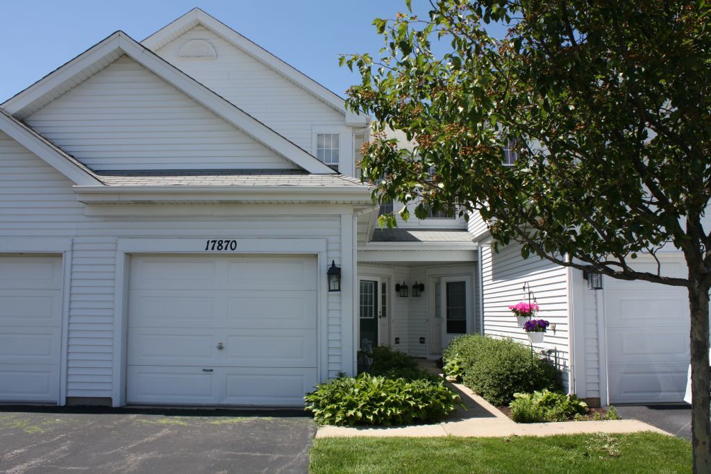 17870 Braewick Road Gurnee, IL 60031 - Photo 1 of 28 a front view of a house with a yard
