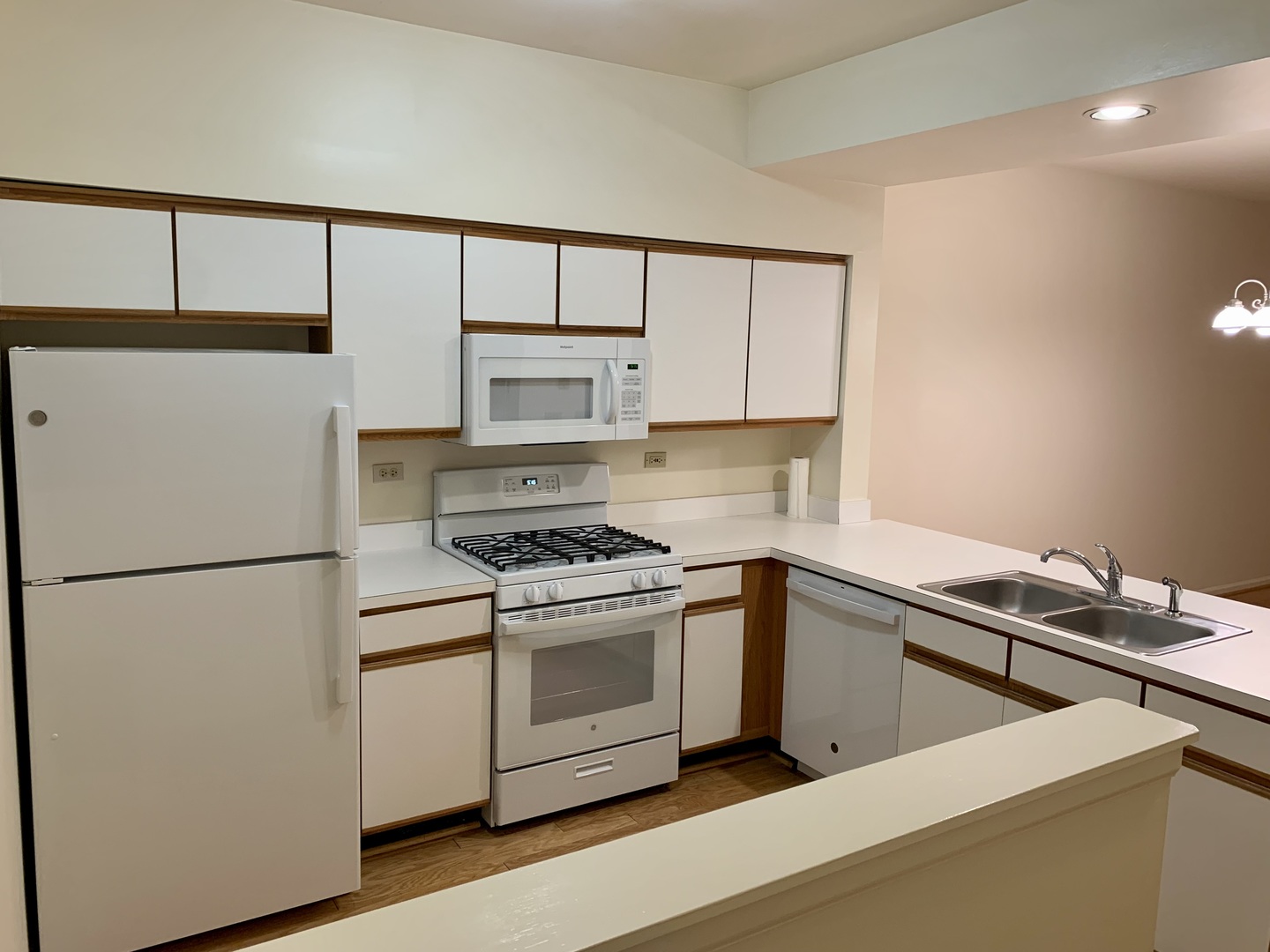 17870 Braewick Road Gurnee, IL 60031 - Photo 5 of 28 a kitchen with a stove cabinets and a refrigerator