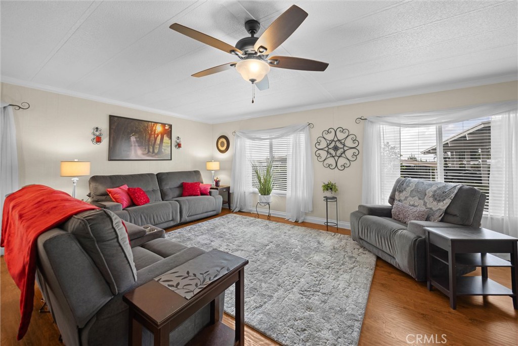 9800 Base Line Road, Unit 71 Rancho Cucamonga, CA 91701 - Photo 1 of 42 a living room with furniture and a large window