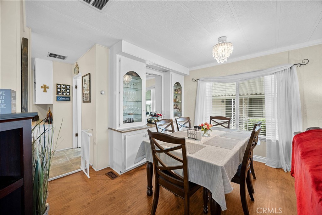 9800 Base Line Road, Unit 71 Rancho Cucamonga, CA 91701 - Photo 11 of 42 a view of a dining room with furniture and window