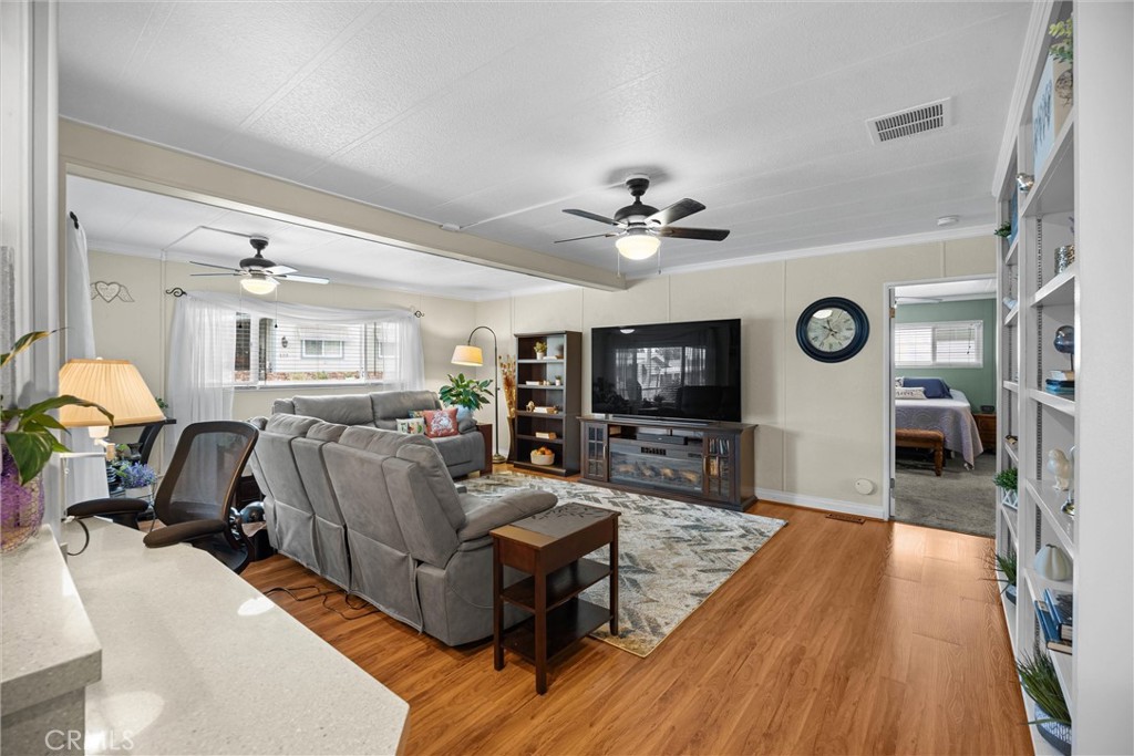 9800 Base Line Road, Unit 71 Rancho Cucamonga, CA 91701 - Photo 20 of 42 a living room with furniture and a flat screen tv