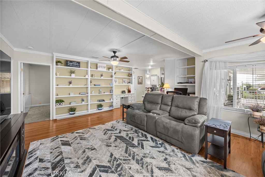 9800 Base Line Road, Unit 71 Rancho Cucamonga, CA 91701 - Photo 22 of 42 a living room with furniture and a flat screen tv