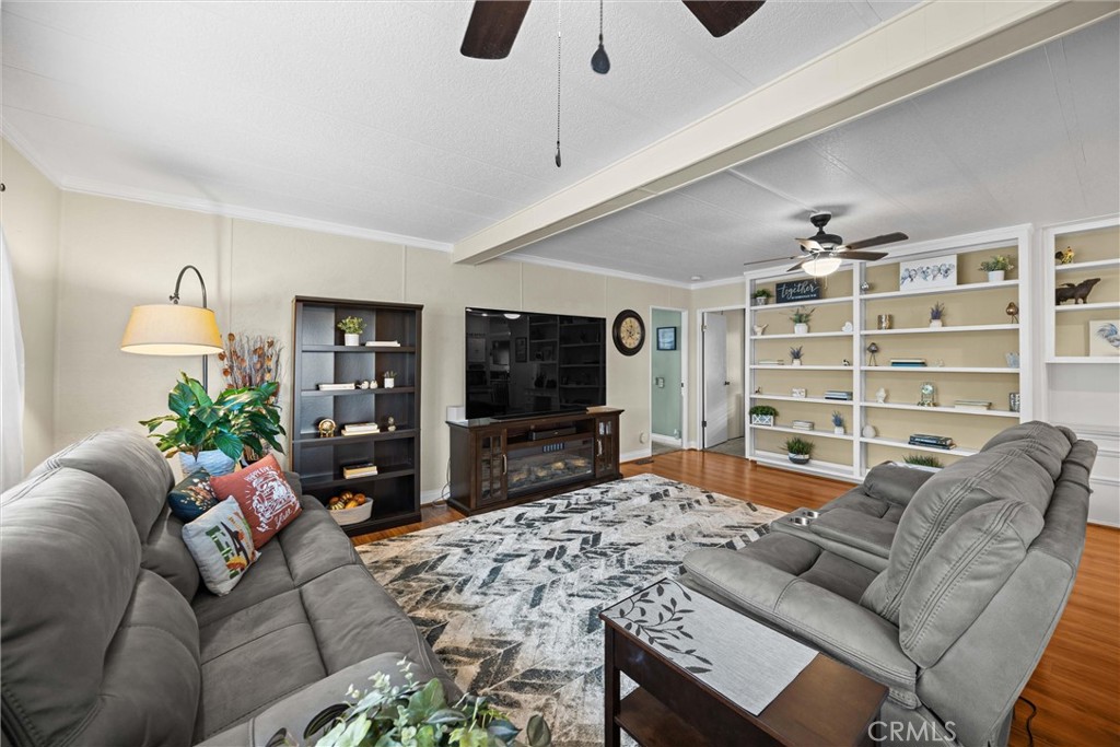 9800 Base Line Road, Unit 71 Rancho Cucamonga, CA 91701 - Photo 23 of 42 a living room with furniture and a flat screen tv