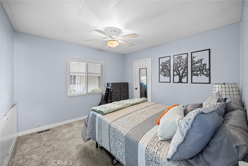 9800 Base Line Road, Unit 71 Rancho Cucamonga, CA 91701 - Photo 24 of 42 a bedroom with a large bed and a window