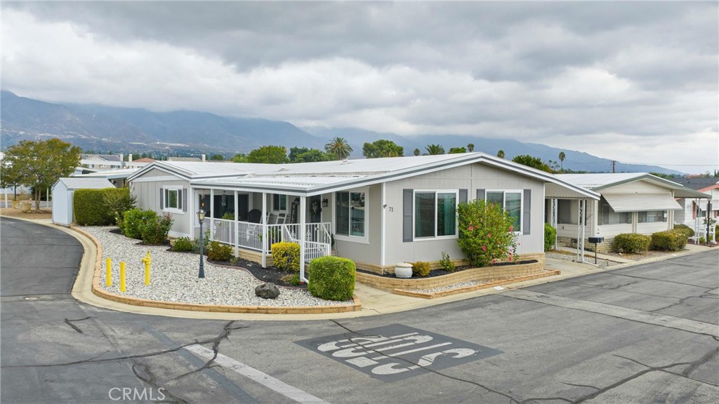 9800 Base Line Road, Unit 71 Rancho Cucamonga, CA 91701 - Photo 3 of 42 a front view of house with a garden