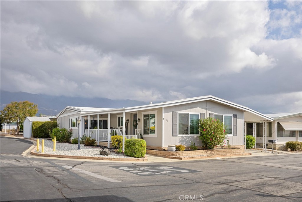 9800 Base Line Road, Unit 71 Rancho Cucamonga, CA 91701 - Photo 4 of 42 a front view of house with yard and green space