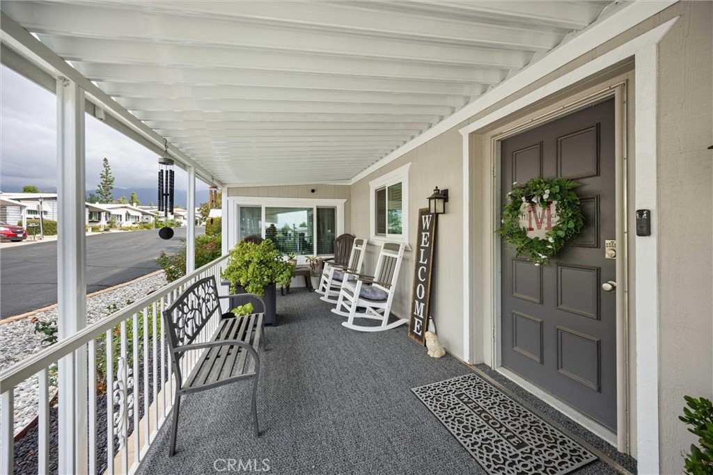 9800 Base Line Road, Unit 71 Rancho Cucamonga, CA 91701 - Photo 6 of 42 a view of a porch with wooden floor