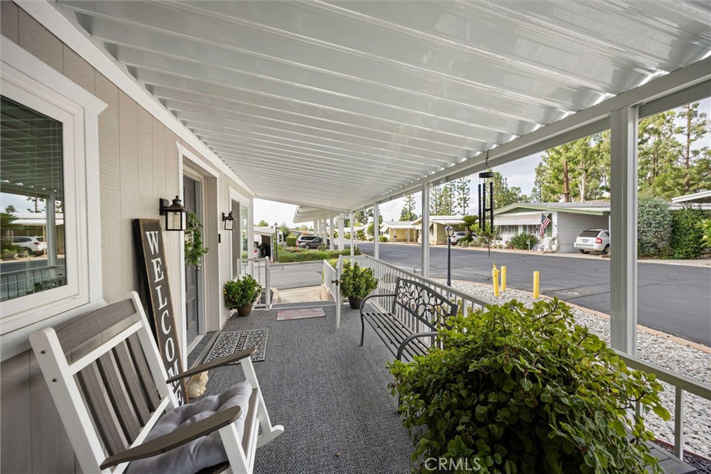 9800 Base Line Road, Unit 71 Rancho Cucamonga, CA 91701 - Photo 7 of 42 a view of a porch with chairs and backyard