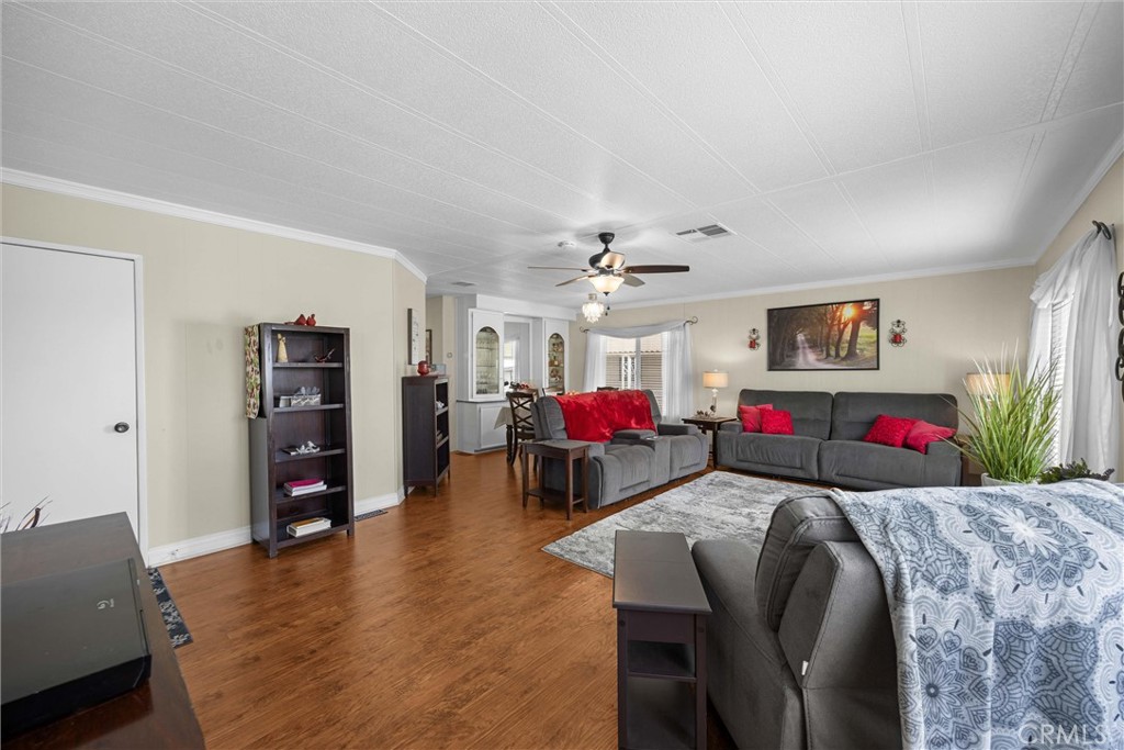 9800 Base Line Road, Unit 71 Rancho Cucamonga, CA 91701 - Photo 8 of 42 a living room with furniture and a wooden floor