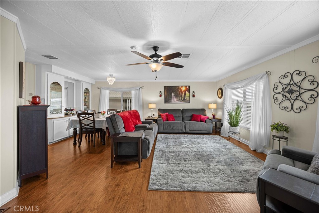 9800 Base Line Road, Unit 71 Rancho Cucamonga, CA 91701 - Photo 9 of 42 a living room with furniture and a wooden floor
