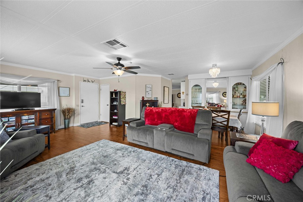 9800 Base Line Road, Unit 71 Rancho Cucamonga, CA 91701 - Photo 10 of 42 a living room with furniture and a flat screen tv