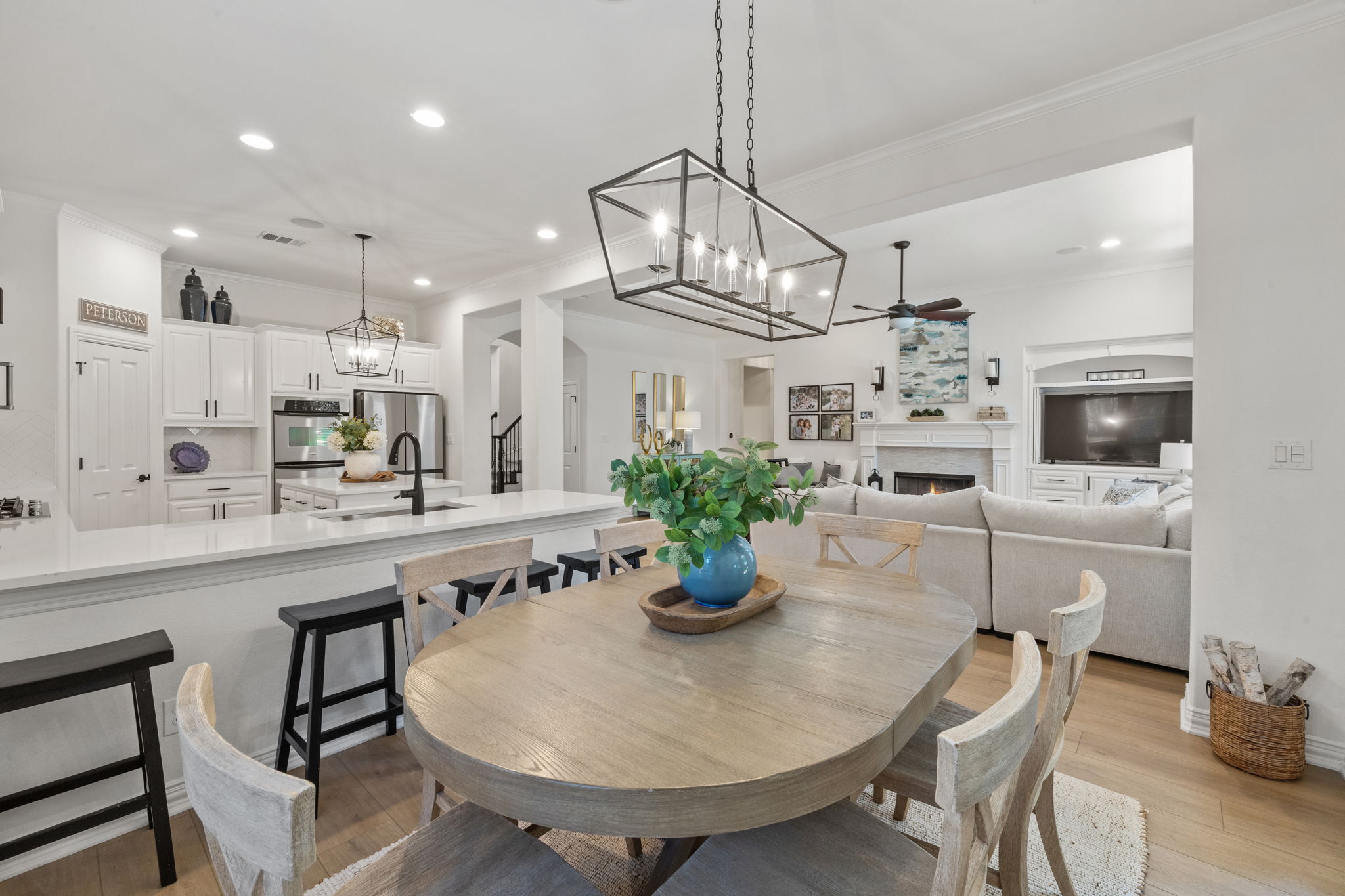 1124 Castle Path Round Rock, TX 78681 - Photo 19 of 40 Natural light illuminates an inviting open-concept space featuring a dining area, kitchen, and living room.