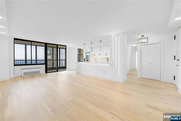 a view of an empty room with a window