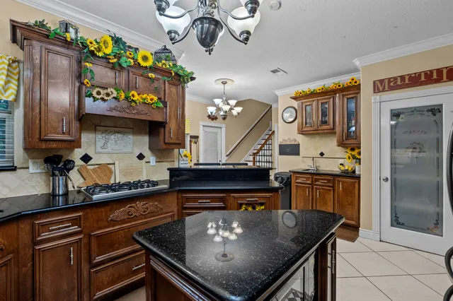 a kitchen with a stove a refrigerator and a sink