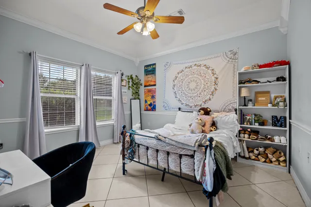 a bed room with furniture and a window