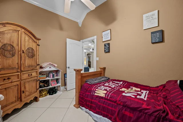 a bedroom with a bed and a cabinets