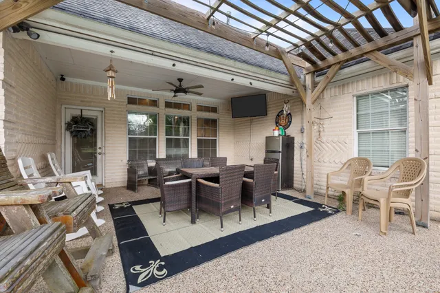 a living room with lots of furniture and a rug