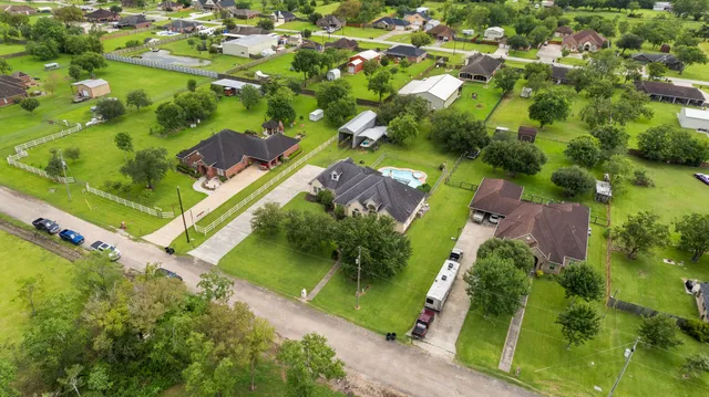 an aerial view of residential houses with outdoor space