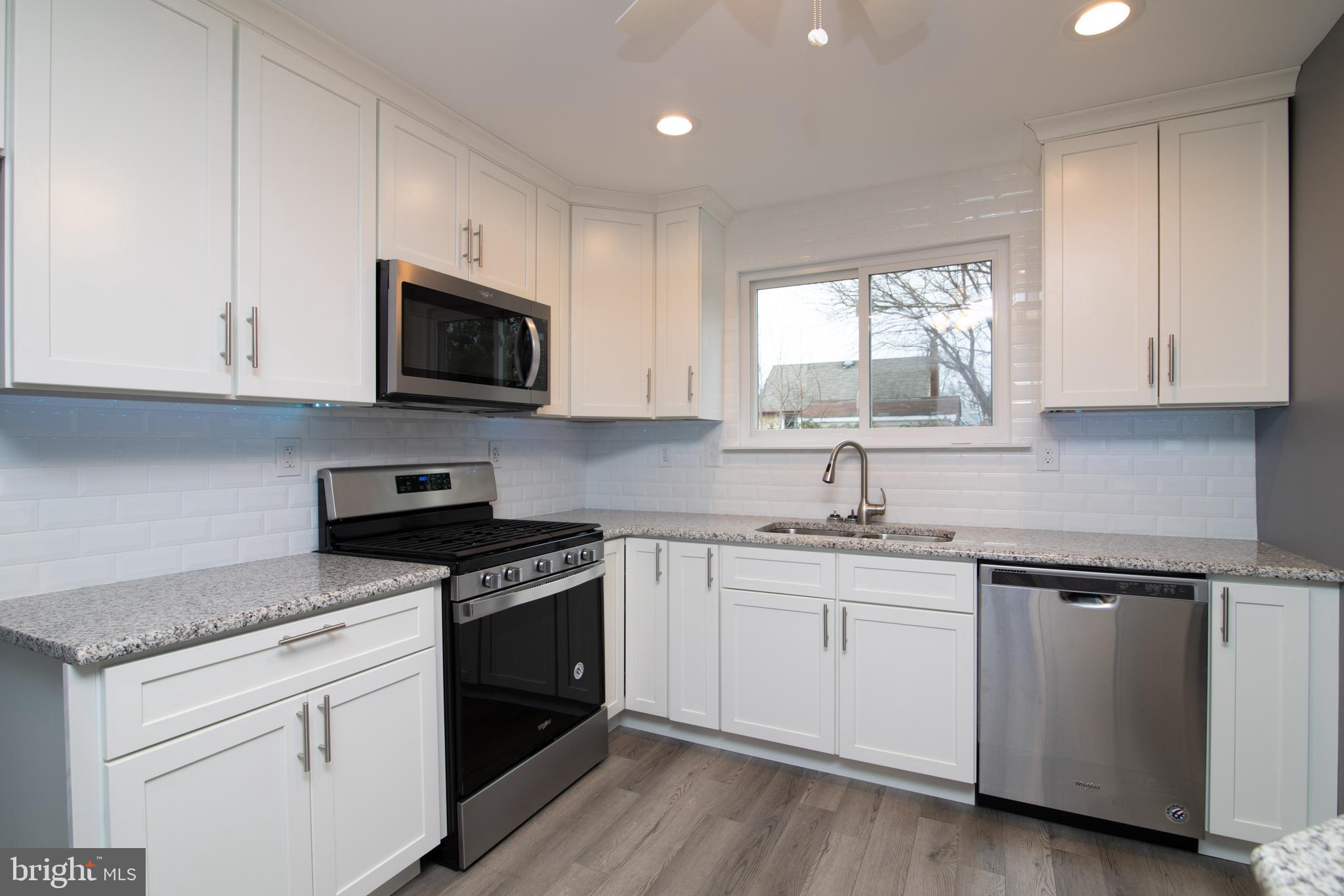 328 Peach Road Bellmawr, NJ 08031 - Photo 5 of 57 Gorgeous white kitchen w new Whirlpool appliances