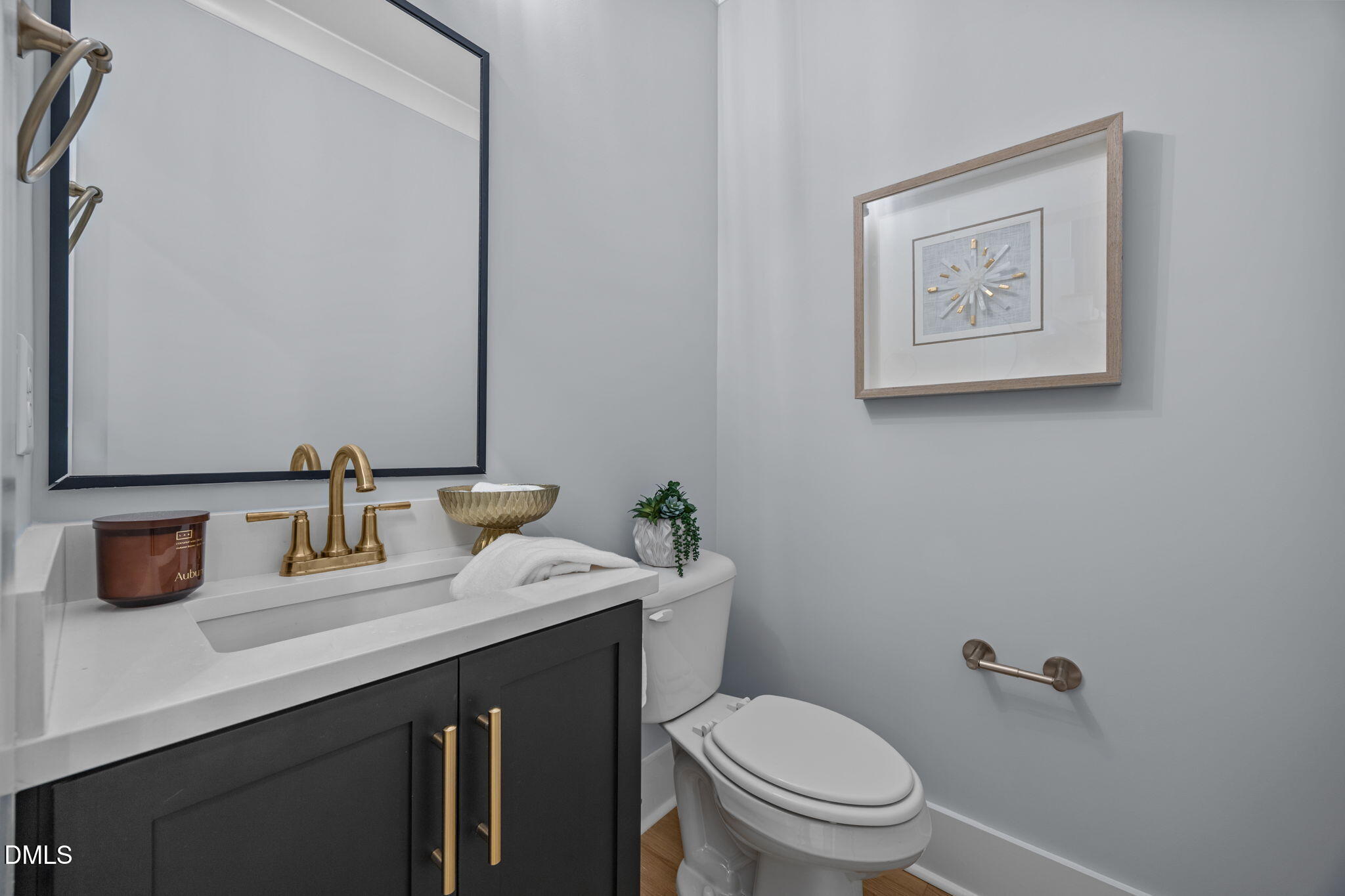 10 Carnation Road Youngsville, NC 27596 - Photo 27 of 47 a bathroom with a toilet sink and mirror