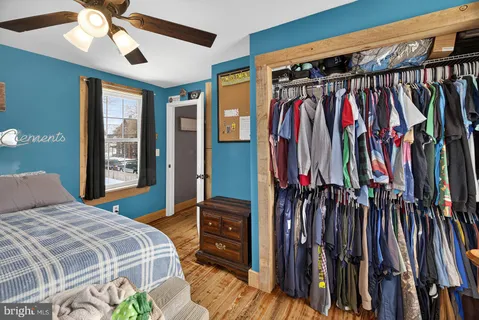 a bedroom with a bed and a walk in closet