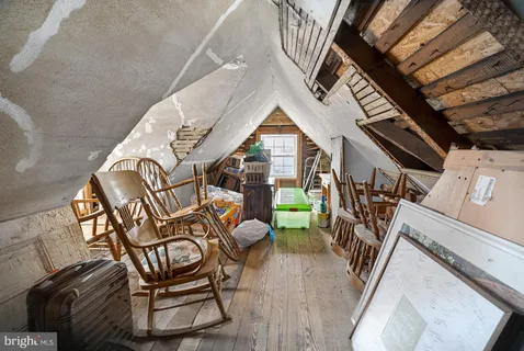 a view of a chairs and table in the balcony