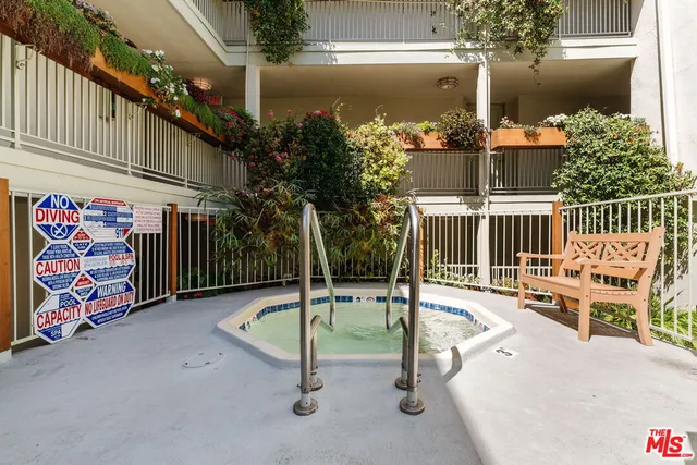 a view of a chairs and table in the patio
