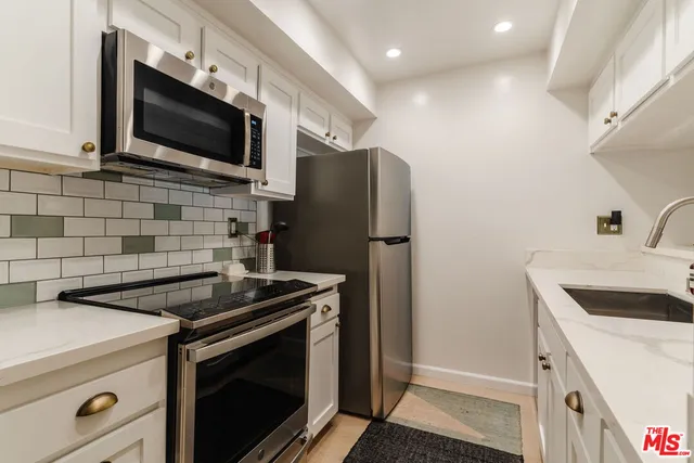 a kitchen with a stove and a microwave