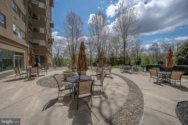 a view of a yard with table and chairs
