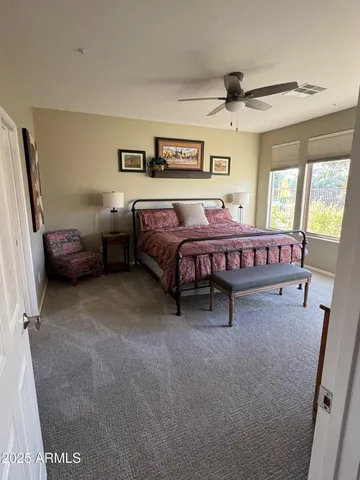 a bedroom with furniture and a window