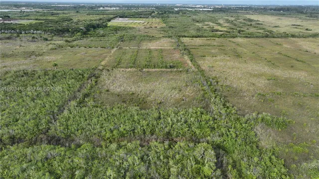 a view of beach and small yard