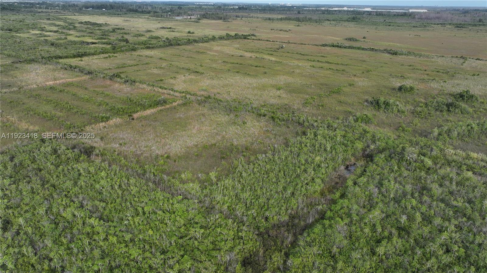 0 Southwest 382nd Street Homestead, FL 33034 - Photo 16 of 27 a view of beach and small yard