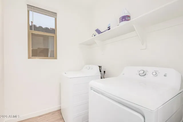 a utility room with dryer and washer