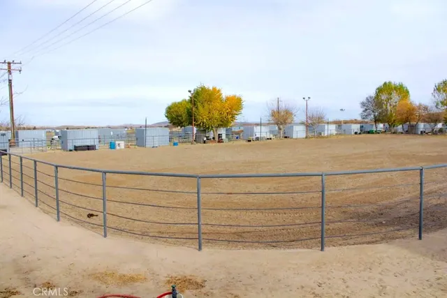 a view of a swimming pool and lounge chairs