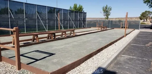 a swimming pool with outdoor seating and yard