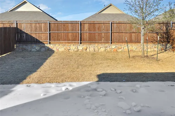 a view of a swimming pool with a yard