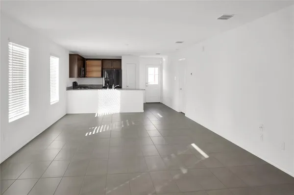 a view of a living room with windows