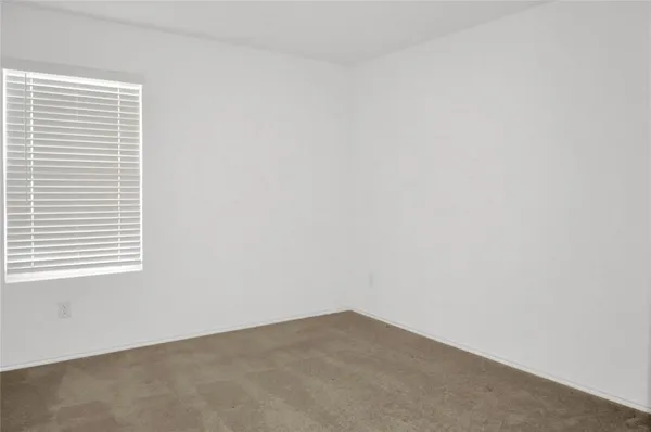 a view of a window in an empty room