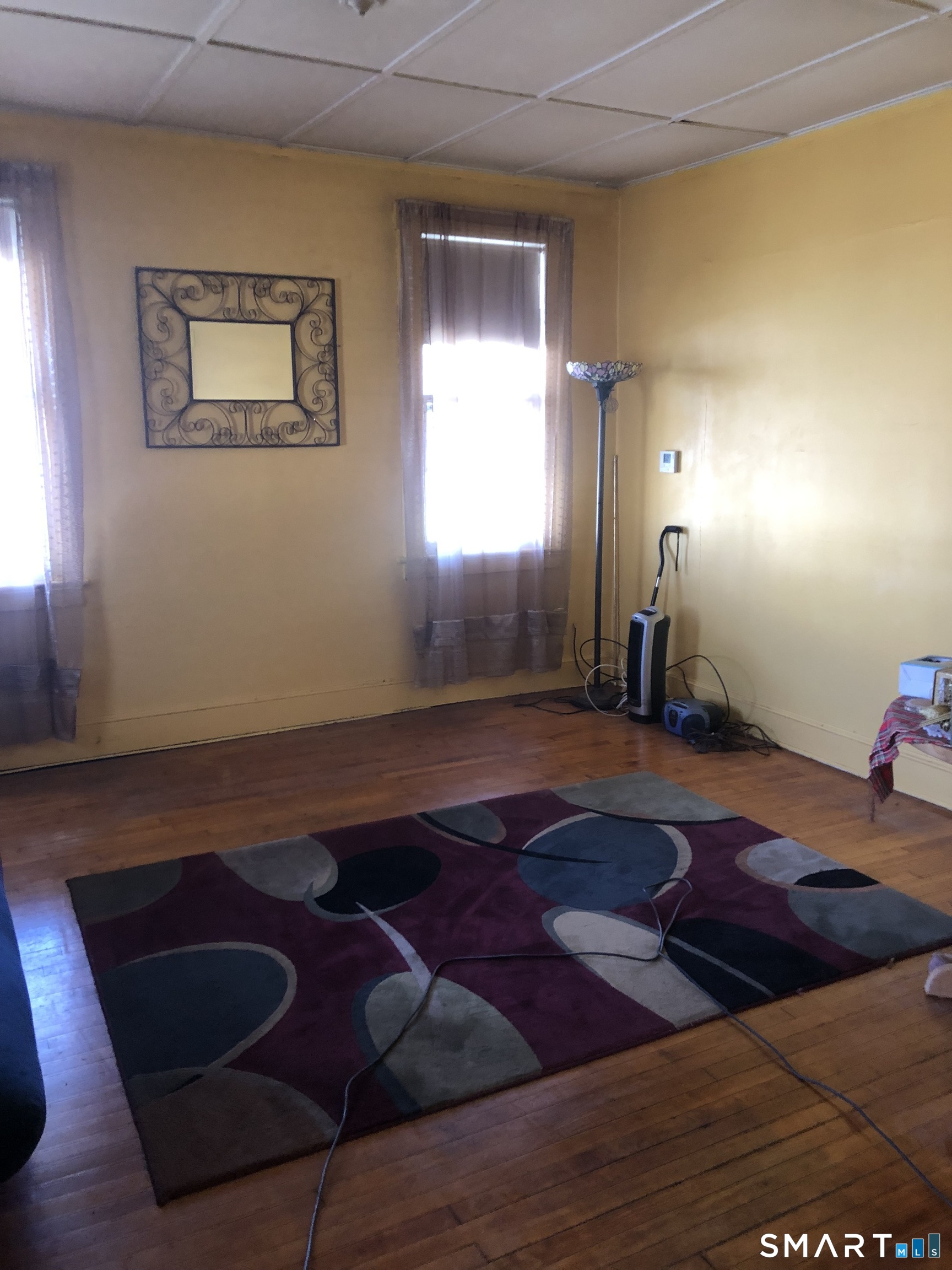 161 Spring Street Meriden, CT 06451 - Photo 15 of 22 a bedroom with a bed and window